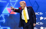 Republican presidential nominee and former US President Donald Trump acknowledges the crowd after speaking at the Israeli American Council National Summit in Washington, DC, September 19, 2024. (AP Photo/Evan Vucci)