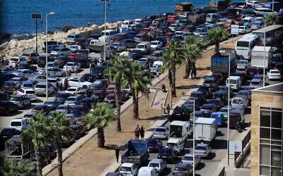 Cars sit in traffic as people flee the southern villages amid ongoing Israeli airstrikes, in Sidon, Lebanon, Monday, Sept. 23, 2024. (AP Photo/Mohammed Zaatari)