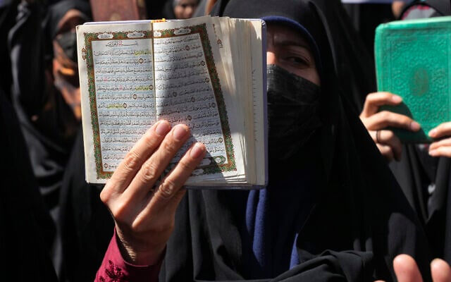 A demonstrator holds up a copy of the Quran, Islam's holy book, during a protest of the burning of a Quran in Sweden, in front of the Swedish Embassy in Tehran, Iran, June 30, 2023. (Vahid Salemi/AP) A demonstrator holds up a copy of the Quran, Islam's holy book, during a protest of the burning of a Quran in Sweden, in front of the Swedish Embassy in Tehran, Iran, June 30, 2023. (Vahid Salemi/AP)