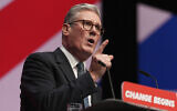 Britain's Prime Minister Keir Starmer addresses members at the Labour Party Conference in Liverpool, England, Sept. 24, 2024. (AP Photo/Jon Super)