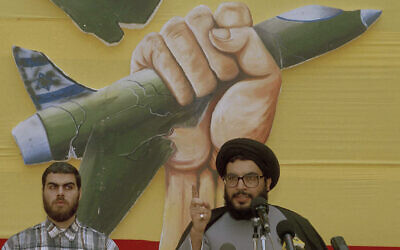 Hassan Nasrallah, leader of Hezbollah, speaks during a ceremony in Beirut on July 24, 1994. (AP Photo/Ahmed Azakir, File)