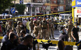 Lebanese soldiers cordon off the area at the site of an Israeli airstrike in Beirut's southern suburbs, September 26, 2024. (AP/Hassan Ammar)