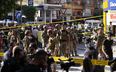 Lebanese soldiers cordon off the area at the site of an Israeli airstrike in Beirut's southern suburbs, September 26, 2024. (AP/Hassan Ammar)