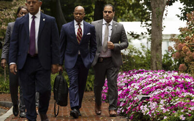 New York City Mayor Eric Adams, second right, exits Gracie Mansion, the official residence of the mayor, September 26, 2024, in New York. (AP/Yuki Iwamura)