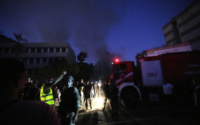 Rescuers arrive near the site of an Israeli airstrike in Beirut's southern suburbs, September 27, 2024. (AP Photo/Hassan Ammar) Rescuers arrive near the site of an Israeli airstrike in Beirut's southern suburbs, September 27, 2024. (AP Photo/Hassan Ammar)