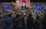 Hezbollah leader Hassan Nasrallah speaks in a televised address via a video link during a ceremony to commemorate the death of the Iranian Revolutionary Guard Gen. Mohammad Reza Zahedi and six officers, who were killed by an Israeli airstrike that demolished Iran's consulate in Syria last Monday, in the southern suburbs of Beirut, Lebanon, on April 8, 2024. (AP Photo/Hassan Ammar, File)