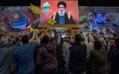 Hezbollah leader Hassan Nasrallah speaks in a televised address via a video link during a ceremony to commemorate the death of the Iranian Revolutionary Guard Gen. Mohammad Reza Zahedi and six officers, who were killed by an Israeli airstrike that demolished Iran's consulate in Syria last Monday, in the southern suburbs of Beirut, Lebanon, on April 8, 2024. (AP Photo/Hassan Ammar, File)