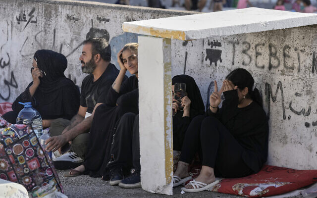 Families sit on the ground in Martyrs' square after fleeing the Israeli airstrikes in Beirut's southern suburbs, Saturday, Sept. 28, 2024. (AP Photo/Bilal Hussein) Families sit on the ground in Martyrs' square after fleeing the Israeli airstrikes in Beirut's southern suburbs, Saturday, Sept. 28, 2024. (AP Photo/Bilal Hussein)
