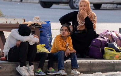 Families fleeing Israeli airstrikes react to the news of the death of Hezbollah leader Hassan Nasrallah in Beirut, Saturday, Sept. 28, 2024. (AP/Bilal Hussein)