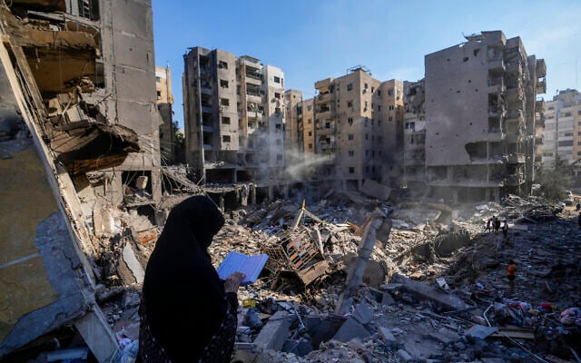A woman reads the Quran at the site of the assassination of Hezbollah terror group leader Hassan Nasrallah in Beirut's southern suburbs, September 29, 2024. (AP Photo/Hassan Ammar) A woman reads the Quran at the site of the assassination of Hezbollah terror group leader Hassan Nasrallah in Beirut's southern suburbs, September 29, 2024. (AP Photo/Hassan Ammar)