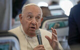 Pope Francis talks to journalists on the flight back to Rome at the end of his four-day visit to Belgium and Luxembourg, Semtember 29, 2024. (AP Photo/Andrew Medichini, Pool)