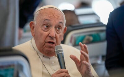 Pope Francis talks to journalists on the flight back to Rome at the end of his four-day visit to Belgium and Luxembourg, Semtember 29, 2024. (AP Photo/Andrew Medichini, Pool)