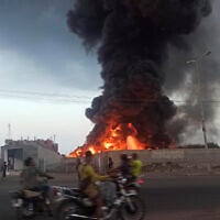 A large fire and plume of smoke is visible in the port city of Hodeida, Yemen, September 29, 2024, after Israeli strikes on the Houthi-controlled city. (AP Photo/ File)