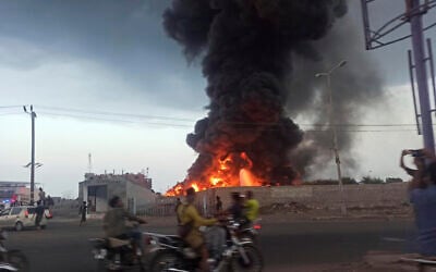A large fire and plume of smoke is visible in the port city of Hodeida, Yemen, September 29, 2024, after Israeli strikes on the Houthi-controlled city. (AP Photo/ File)