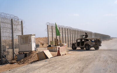 IDF Humvees enter the Gaza Strip near Kerem Shalom, July 15, 2024. (Emanuel Fabian/Times of Israel)