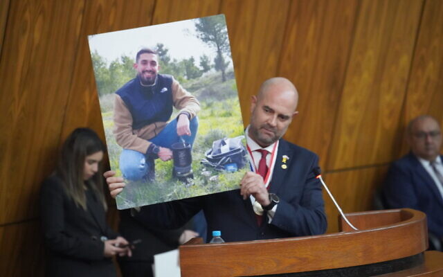 Knesset Speaker Amir Ohana holds up a picture of murdered hostage Ori Danino while addressing the Paraguayan parliament in Asuncion, September 17, 2024. (Knesset Spokesman) Knesset Speaker Amir Ohana holds up a picture of murdered hostage Ori Danino while addressing the Paraguayan parliament in Asuncion, September 17, 2024. (Knesset Spokesman)