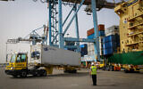 Illustrative: Ashdod port workers unload a container with millions of eggs imported from Spain at Ashdod port on April 5, 2020. (Flash90)