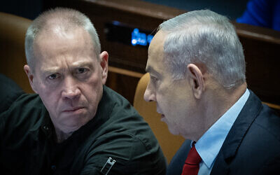 Prime Minister Benjamin Netanyahu, right, and Defense Minister Yoav Gallant attend a vote on the state budget at the Knesset plenum in Jerusalem, March 13, 2024. (Yonatan Sindel/Flash90)