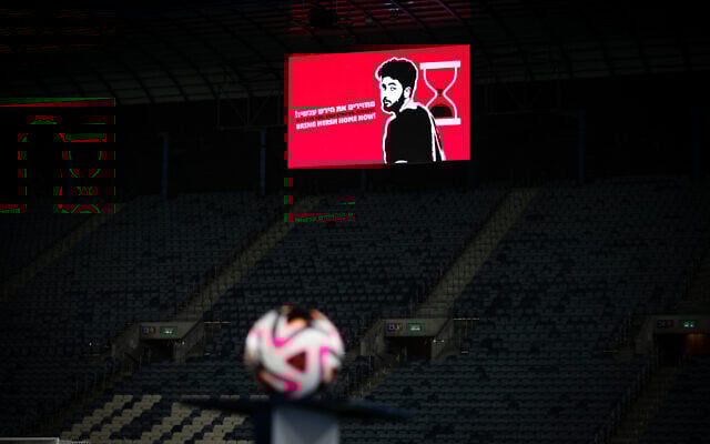 Hostage Hersh Goldberg-Polin seen on a screen during the Israeli Premier League match between Hapoel Hadera and Hapoel Jerusalem at the Teddy Stadium in Jerusalem, August 31, 2024. (Oren Ben Hakoon/Flash90) Hostage Hersh Goldberg-Polin seen on a screen during the Israeli Premier League match between Hapoel Hadera and Hapoel Jerusalem at the Teddy Stadium in Jerusalem, August 31, 2024. (Oren Ben Hakoon/Flash90)
