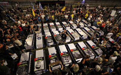 Israelis demonstrate around 27 coffins symbolizing hostages killed in Gaza, as they protest for the release of Israelis held by Hamas terrorists in Gaza, outside the Defense Ministry Headquarters in Tel Aviv, September 5, 2024. (Jamal Awad / Flash90)