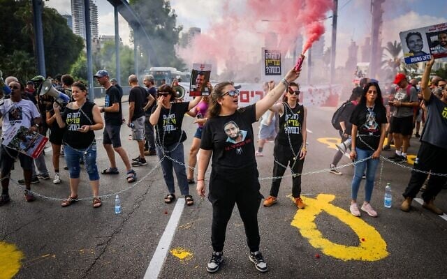 Families of Israelis held kidnapped by Hamas terrorists in Gaza and activists block a main road in Tel Aviv, during a protest calling for a hostage deal, September 13, 2024. (Chaim Goldberg/Flash90)