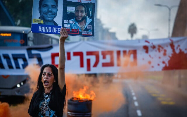Einav Zangauker, whose son Matan is held hostage in Gaza, blocks a main road in Tel Aviv, during a protest calling for the release of the hostages, September 13, 2024. (Chaim Goldberg/Flash90) Einav Zangauker, whose son Matan is held hostage in Gaza, blocks a main road in Tel Aviv, during a protest calling for the release of the hostages, September 13, 2024. (Chaim Goldberg/Flash90)