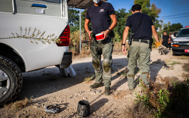Police near the remains of a ballistic missile fired by the Iran-backed Houthis from Yemen, near Moshav Kfar Daniel, September 15, 2024. (Yossi Aloni/Flash90)