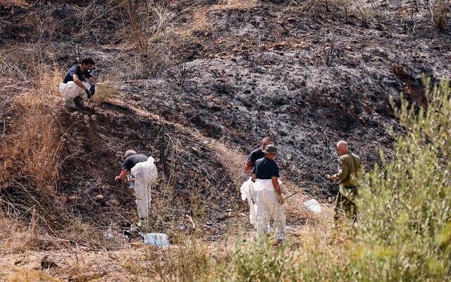 Police at the site where part of a ballistic missile fired from Yemen hit an open area near Moshav Kfar Daniel, September 15, 2024. (Yossi Aloni/Flash90)