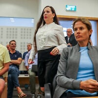 Anti-government activist Shikma Bressler (R) and MK Tally Gotliv (C) arrive for a court hearing in Bressler's defamation lawsuit against Gotliv at the District Court in Lod, September 17, 2024. (Jonathan Shaul/Flash90)