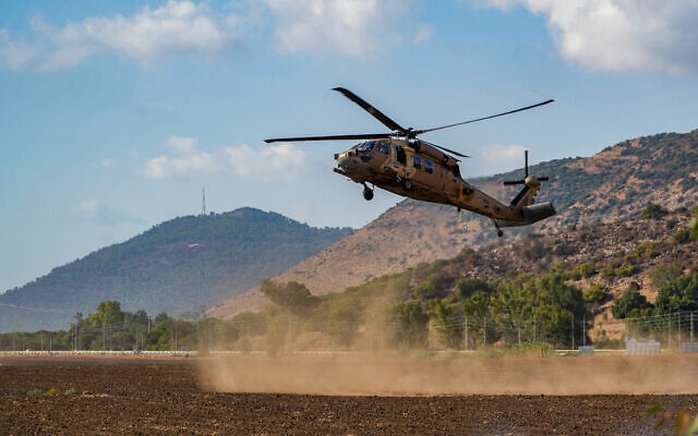 Israeli soldiers evacuate wounded by a Hezbollah missile strike in the Ramim Cliff area, near the Israeli border with Lebanon, September 19, 2024. (Ayal Margolin/Flash90)