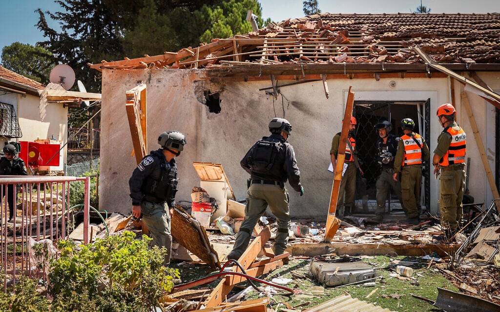 The site where a rocket fired from Lebanon hit a house and cars in the northern city of Safed, September 25, 2024. (David Cohen/Flash90) The site where a rocket fired from Lebanon hit a house and cars in the northern city of Safed, September 25, 2024. (David Cohen/Flash90)