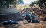 Israeli security forces at the scene where a drone launched from Iraq hit an open area near the border with Syria on September 25, 2024. (Maor Kinsbursky/Flash90)