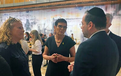 Dr. Hilla Hadas, CEO of Enosh, center, with Health Minister Uriel Buright, and Ayelet Nahmias Verbin, chair of the Jewish Agency fund for victims of terror at the Enosh Mental Health Conference on September 4, 2024. (Diana Bletter/Times of Israel)