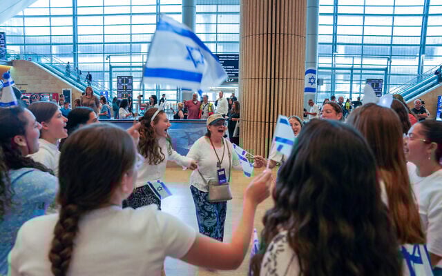 New Olim celebrating landing in early July at terminal 3 in Ben Gurion Airport.