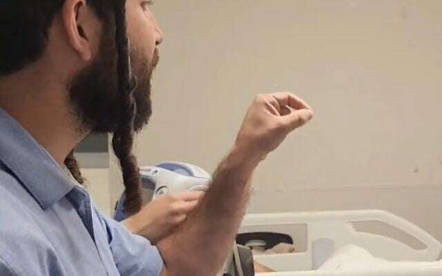 Far-right MK Zvi Sukkot is seen threatening a Palestinian terrorist in his hospital bed on September 11, 2024 (Screencapture X: used in accordance with Clause 27a of the Copyright Law) Far-right MK Zvi Sukkot is seen threatening a Palestinian terrorist in his hospital bed on September 11, 2024 (Screencapture X: used in accordance with Clause 27a of the Copyright Law)