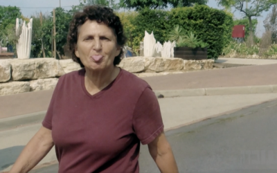 Kinneret Gat, 67, is seen sticking her tongue out at Hamas terrorists shortly before her murder during the terror group's October 7, 2023, assault on southern Israel, as seen in a Channel 12 documentary broadcast on September 26, 2024. (Screen capture via N12, used in accordance with Clause 27a of the Copyright Law)
