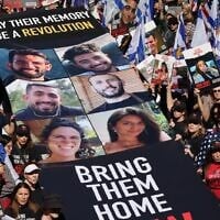 Pro-Israel activists hold a banner with the photos of six hostages executed by Hamas in Gaza, while calling for the release of the remaining Israelis abducted by the Palestinian terror group on October 7, in Central Park, in New York City, on September 8, 2024. (Hostages Families Forum/ Amnon Shemi, Liri Agami)