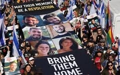 Pro-Israel activists hold a banner with the photos of six hostages executed by Hamas in Gaza, while calling for the release of the remaining Israelis abducted by the Palestinian terror group on October 7, in Central Park, in New York City, on September 8, 2024. (Hostages Families Forum/ Amnon Shemi, Liri Agami)