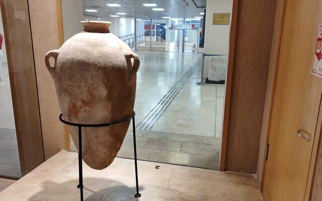 A restored 3,500 year-old jug that had been accidently broken by a four-year-old boy, at the Hecht Museum in Haifa on September 11, 2024. (Gavriel Fiske/Times of Israel)