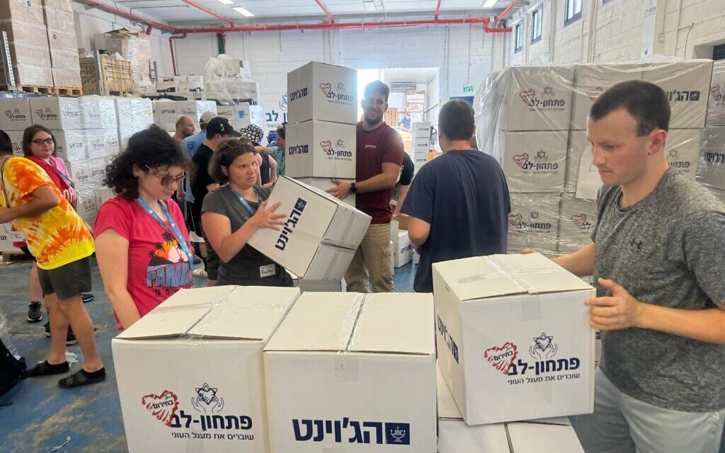 A group of Camp Ramah/Birthright participants help pack food supplies in Israel, September 2024. The trip was for adults with non-physical disabilities who volunteered in various locations around Israel. (courtesy Howard Blas) A group of Camp Ramah/Birthright participants help pack food supplies in Israel, September 2024. The trip was for adults with non-physical disabilities who volunteered in various locations around Israel. (courtesy Howard Blas)