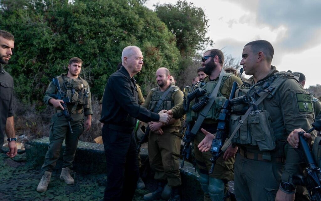 Defense Minister Yoav Gallant speaks with troops in northern Israel, September 30, 2024. (Ariel Hermoni/ Defense Ministry)