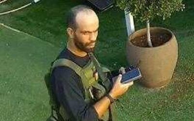 Ahmed Fawzi Nasser Muhammad Wadiyya, a Hamas Nukhba commander who led the massacre in moshav Netiv Ha'asara on October 7, 2023, is seen in CCTV footage from the attack that day. (Israel Defense Forces) Ahmed Fawzi Nasser Muhammad Wadiyya, a Hamas Nukhba commander who led the massacre in moshav Netiv Ha'asara on October 7, 2023, is seen in CCTV footage from the attack that day. (Israel Defense Forces)