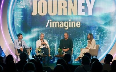 Mellanox founder Eyal Waldman (second from right) speaks at a panel discussion at the annual Journey conference by Ernst & Young Israel in Tel Aviv, Sept. 10, 2024. (Courtesy)