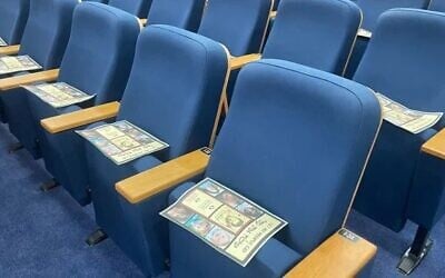 Flyers urging the release of hostages held by Hamas placed on the seats at a synagogue in Herzliya, September 13, 2024 (Detainee Support Organization)