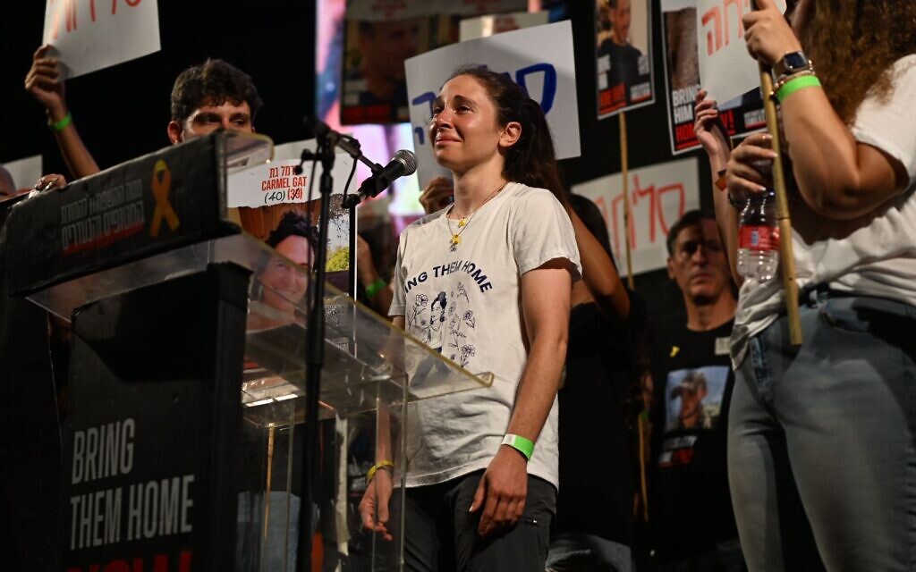 Shai Dickman, cousin of hostage Carmel Gat who was murdered last month by her Hamas captors, speaks at a rally urging a deal to save the remaining hostages, in Tel Aviv, September 7, 2024.(Lior Rotstein / Hostage Families' Forum)