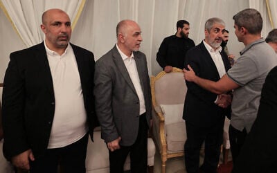 From L to R: Senior Hamas official Zaher Jabarin, the chairman of the group's consultative council Mohammed Ismail Darwish, known as Abu Omar Hassan, and the Palestinian movement's senior official Khaled Mashaal receive condolences during the funeral of the Palestinian movement's political leader Ismail Haniyeh in the Qatari capital Doha on August 2, 2024. (Mahmud Hams/AFP)