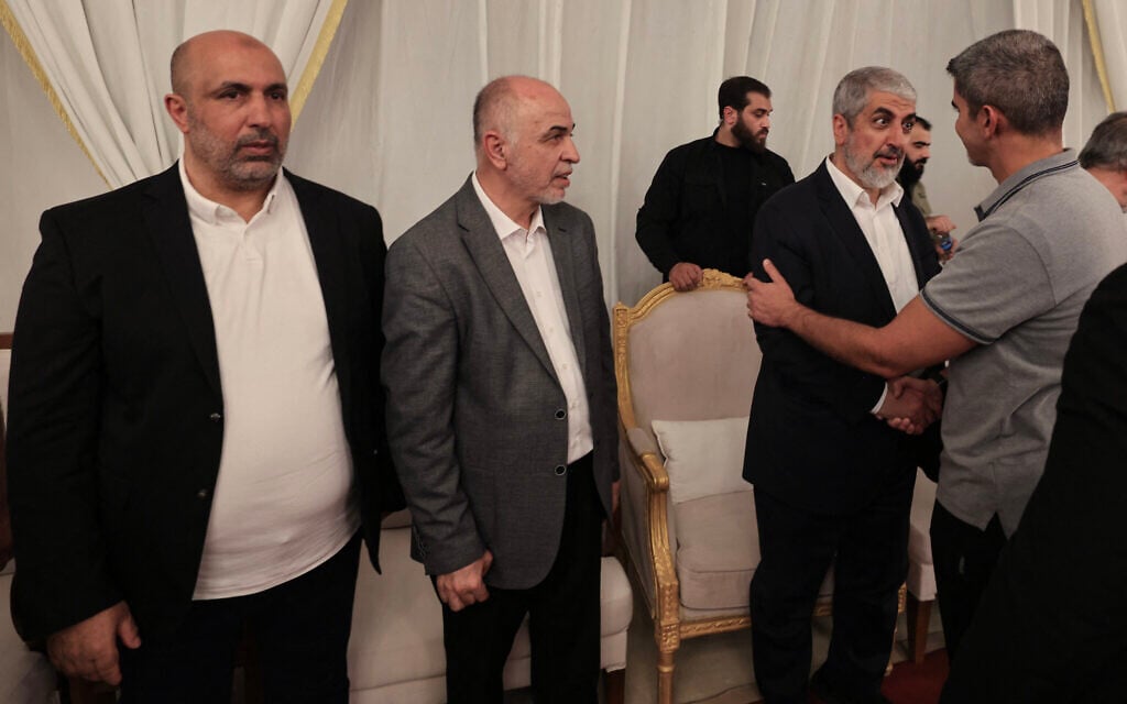 From left to right: Hamas West Bank leader Zaher Jabarin, the chairman of the group's consultative council Mohammed Ismail Darwish, known as Abu Omar Hassan, and senior official Khaled Mashaal receive condolences during the funeral of the terror group's top leader Ismail Haniyeh in the Qatari capital Doha on August 2, 2024. (Mahmud Hams/AFP)