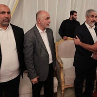 From left to right: Hamas West Bank leader Zaher Jabarin, the chairman of the group's consultative council Mohammed Ismail Darwish, known as Abu Omar Hassan, and senior official Khaled Mashaal receive condolences during the funeral of the terror group's top leader Ismail Haniyeh in the Qatari capital Doha on August 2, 2024. (Mahmud Hams/AFP)