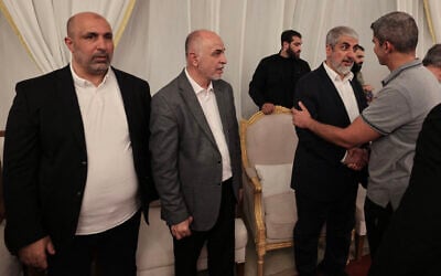 From left to right: Hamas West Bank leader Zaher Jabarin, the chairman of the group's consultative council Mohammed Ismail Darwish, known as Abu Omar Hassan, and senior official Khaled Mashaal receive condolences during the funeral of the terror group's top leader Ismail Haniyeh in the Qatari capital Doha on August 2, 2024. (Mahmud Hams/AFP)