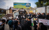 Jewish men seen outside the tomb of Rabbi Nachman of Breslov in Uman, ahead of the Jewish holiday of Rosh Hashanah, October 1, 2024. (Chaim Goldberg/Flash90)